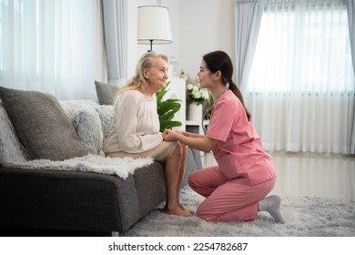 Caregiver for an elderly woman Weekly check-ups at the patient's residence. Ready to give medical advice and talk about various stories, exchange each other happily. - Shutterstock ID 2254782687