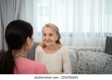 Caregiver for an elderly woman Weekly check-ups at the patient's residence. Ready to give medical advice and talk about various stories, exchange each other happily. - Shutterstock ID 2254782691