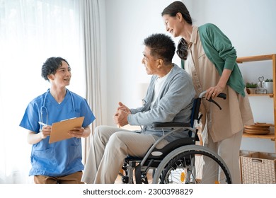 Caregiver and Japanese couple at home