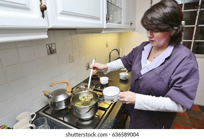 A Caregiver Is Making Soup