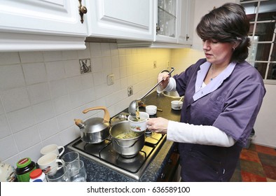 A Caregiver Is Making Soup