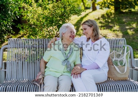 Similar – Senior dissatisfied woman in a wheelchair with her daughter