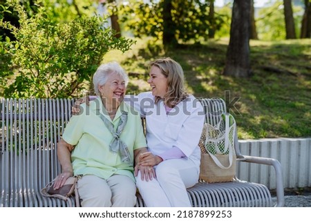 Similar – Senior dissatisfied woman in a wheelchair with her daughter