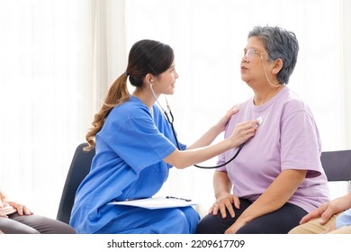The caregiver therapist check heartbeat of Asian senior woman by stethoscope. Checking physical and mental health in a group elderly therapy session. The nursing home facilitates a support group - Shutterstock ID 2209617709