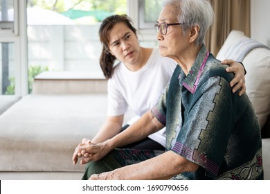 Caregiver Woman Is Taking Care,support Of Sad Senior, Depressed Elderly Looking Away Outside Waiting For Her Family To Visit At Nursing Home, Nostalgia, Stressed, Anxious,life Depression Of Old People