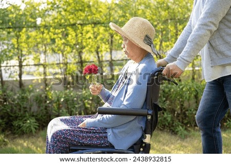 Similar – Senior woman in a wheelchair with her daughter