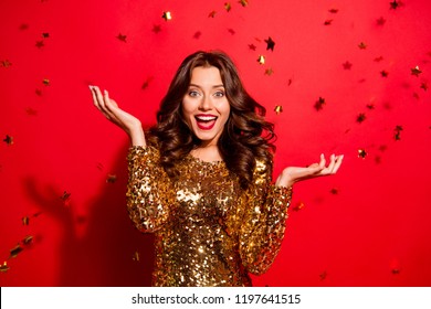 Careless, carefree, dream, dreamy concept. Beautiful, attractive, pretty, charming, modern wave hairstyle lady look at camera with raised hands up and open mouth isolated on shine red background - Powered by Shutterstock