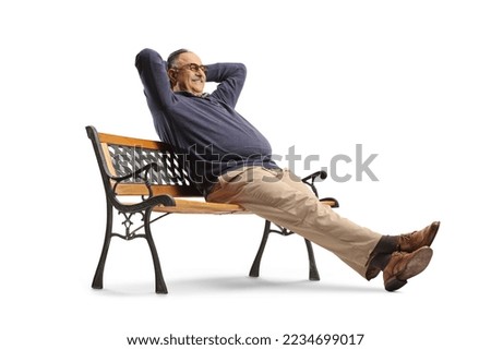 Careless mature man sitting on a bench and resting isolated on white background