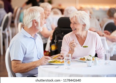 Carer Leading Group Of Seniors In Fitness Class In Retirement Home - Powered by Shutterstock