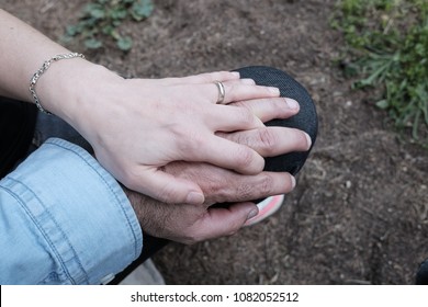 caresses between hands