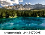Carezza Lake. Beautifull blue lake in the Dolomites of Trentino Alto Adige, Nova Levante. Paradise landscape at Karersee with mountain Latemar. Italy.