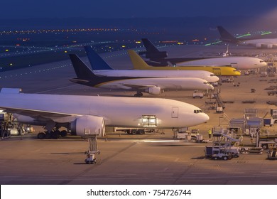 Cargo Airplanes At An Airport At Night