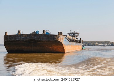 Cargo barge and push-boat are on the way. Danube river
