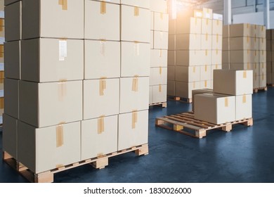 Cargo boxes, Shipment, Manufacturing and warehousing. Stack of cardboard boxes on pallet at the warehouse storage.