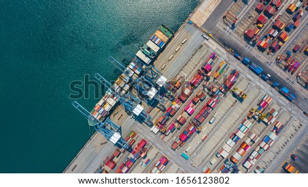 Cargo container in factory harbor at industrial estate for import export around in the world, Trade Port / Shipping - cargo to harbor. Aerial view of sea freight, Cargo ship