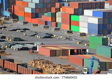 Cargo Container, Pipe, Lumber And Train In Port