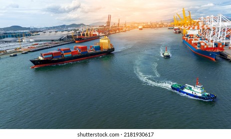 Cargo container ship carrying container and running near Tug boat in international custom shipyard sea port concept smart logistic service. Express boat - Shutterstock ID 2181930617