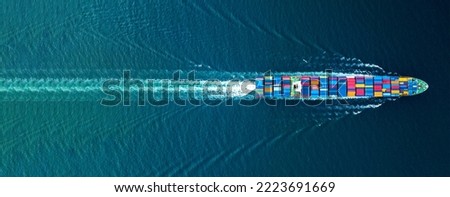Cargo container Ship, cargo maritime ship with contrail in the ocean ship carrying container and running for export  concept technology freight shipping sea freight by Express Ship. top view 