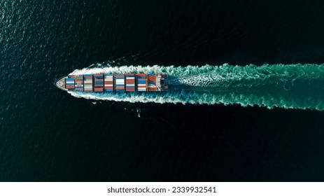 cargo container ship sailing full speed in sea to import export goods and distributing products to dealer and consumers worldwide, by container ship Transport business delivery service, aerial view 