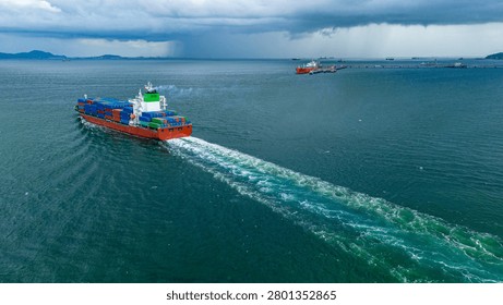 Cargo container ship sailing through the ocean under a dark stormy sky with rain clouds. Concept of global supply chain risk, maritime logistics crisis, and adverse weather navigation.