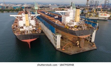 Cargo Container Ship Stern With Propeller At Dry Dock For Maintenance Follow Annual Plan And Service.