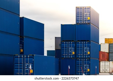 Cargo containers. Cargo container yard. Stack of freight containers at the docks. Industrial yard. Import and export logistic concept.