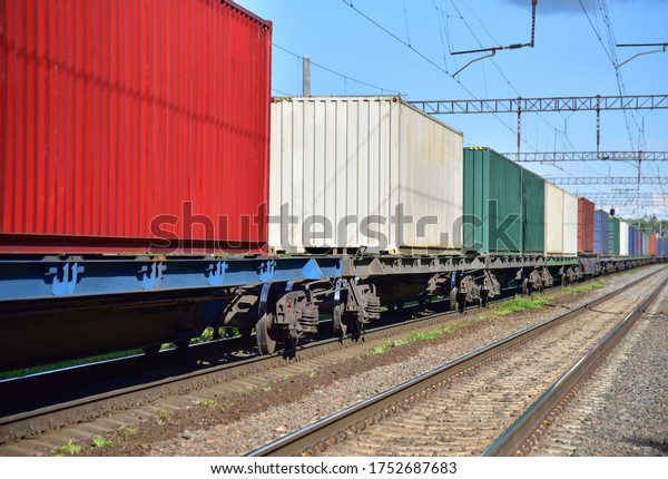Cargo Containers\
Transportation On Freight Train By Railway. Intermodal Container On\
Train Car. Rail Freight Shipping Logistics. Import - export goods\
from Сhina. Soft focus