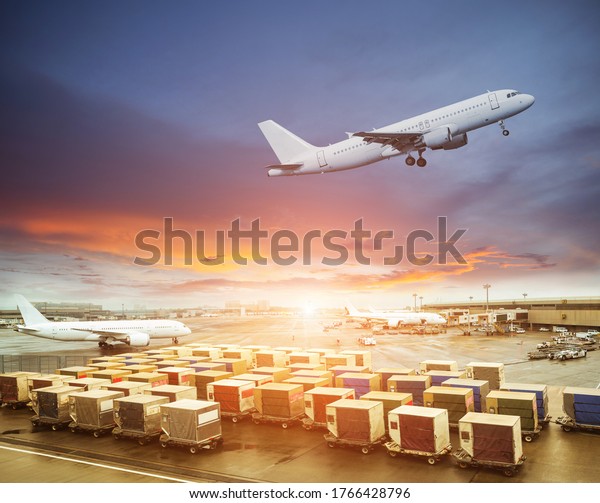 Cargo containers\
waiting load into an\
airliner
