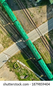 Cargo Delivery By Train, Top Down Aerial View. Business Background. Ukrainian Railway Station. Drone Photography. Green Wagons.