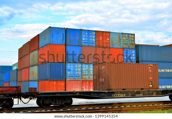 Cargo dock terminal with sea containers. logistic\
warehouse port of shipping container for the subsequent sorting,\
loading and sending them on freight railway cars or trucks to the\
client - Image