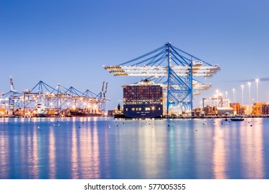 Cargo port in blue hours during unloading in Malta. Written London on the ship.