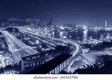 Cargo port and highway in Hong Kong city at night - Powered by Shutterstock