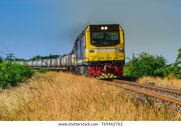 Cargo railway shipping industry and freight\
railroad transportation industrial.Railroad train of tanker cars\
transporting oil on the\
tracks.
