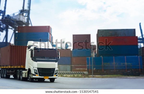 Cargo Red Container truck in ship port\
Logistics.Transportation industry in port business\
concept.import,export logistic industrial Transporting Land\
transport on Port transportation storge    \
