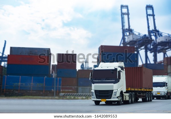 Cargo Red Container truck in ship port\
Logistics.Transportation industry in port business\
concept.import,export logistic industrial Transporting Land\
transport on Port transportation\
storge