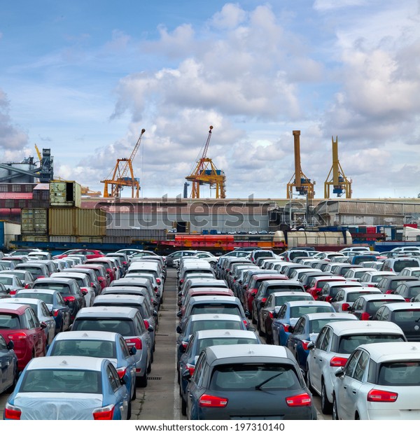 Cargo sea\
port. Sea cargo cranes. Cars.\
Seascape.