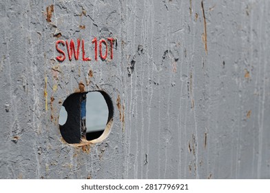 A cargo securing strong point integrated into the main deck bulwark of an offshore support vessel. The bulwark separates the cargo deck from the designated safe passage area and provides protection for personnel moving around the vessel. The strong point is marked with a Safe Working Load (SWL) of 10 tones and is used for securing cargo on the main deck during offshore transportation operations.