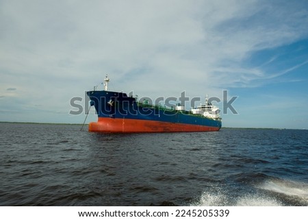 A cargo ship anchored off the Indonesian riau sea