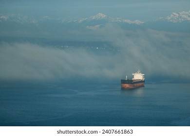 Cargo Ship in Foggy Waters - Powered by Shutterstock