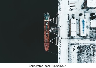 Cargo ship in the harbor at winter. - Powered by Shutterstock