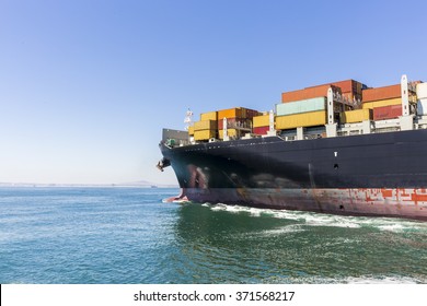 Cargo Ship Loaded With Containers Sailing Away.