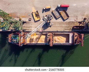 Cargo Ship Loading In Port At Sunset, Aerial View