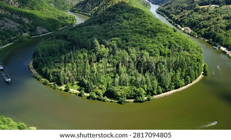 Cargo Ship Navigating the Saar Loop (Saarschleife) in Saarland, Germany