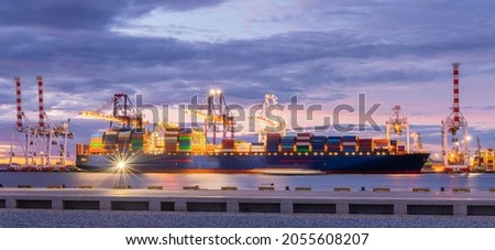 Cargo ship parking at seaport waiting for container dock crane  shipment harbour loading container boxes import and export commercial trade business logistic and transportation of international.