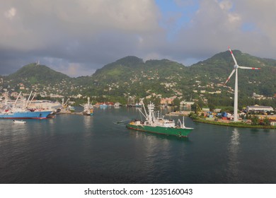 Cargo Ship, Port, Mountains And Clouds. Victoria, Mahe, Seychelles