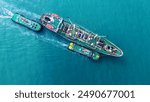 Cargo Ship was pulling by Tugboat go to Maintenance port. cargo ship import export to customers sea port. export shipping industry freight and transportation logistics concept.	