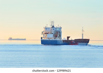 Cargo Ship Sailing Away