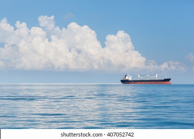 Cargo ship sailing in ocean, shipping business concept