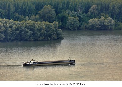 Cargo ship sailing on the river Danube, important waterway in Europe