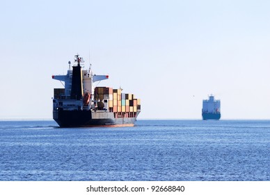 Cargo Ship Sailing In Still Water